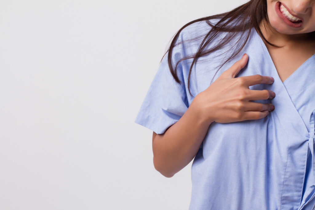sick stressed woman with acid reflux, gerd symptoms